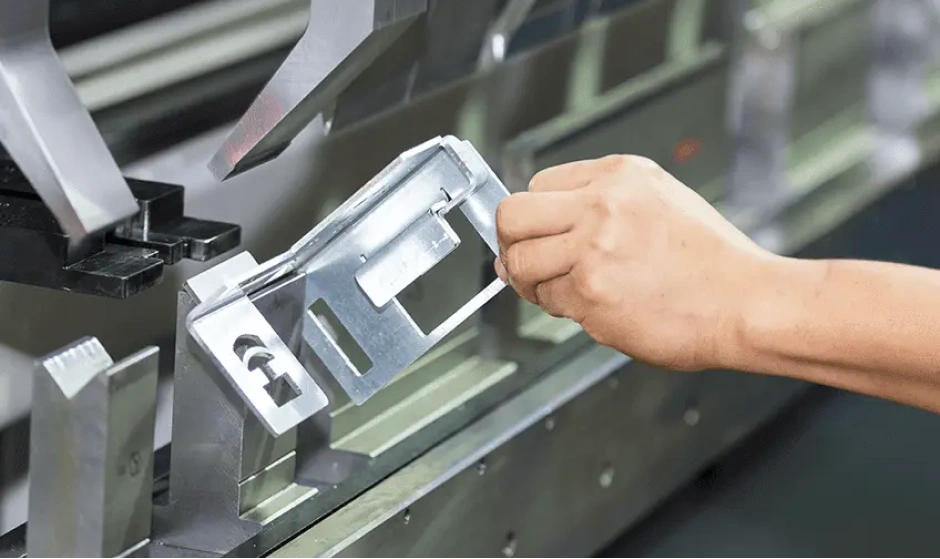 Professional sheet metal bending process on industrial press brake at Bludeek facility for high precision metal fabrication and structural component manufacturing